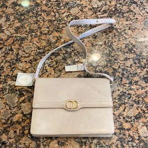 Christian dior shoulder bag. Some shelf wear and possible material transfer.